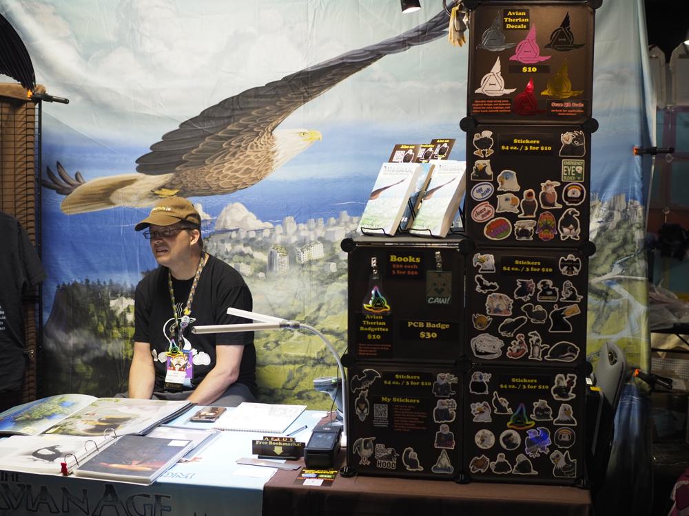 A stand where an author is selling their bird themed book
